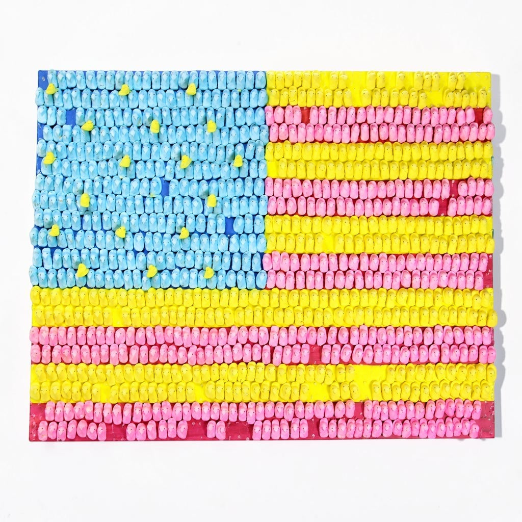 Outrageous Art patriotic American flag wall art made from textured blue, yellow, and pink marshmallow candy shapes.
