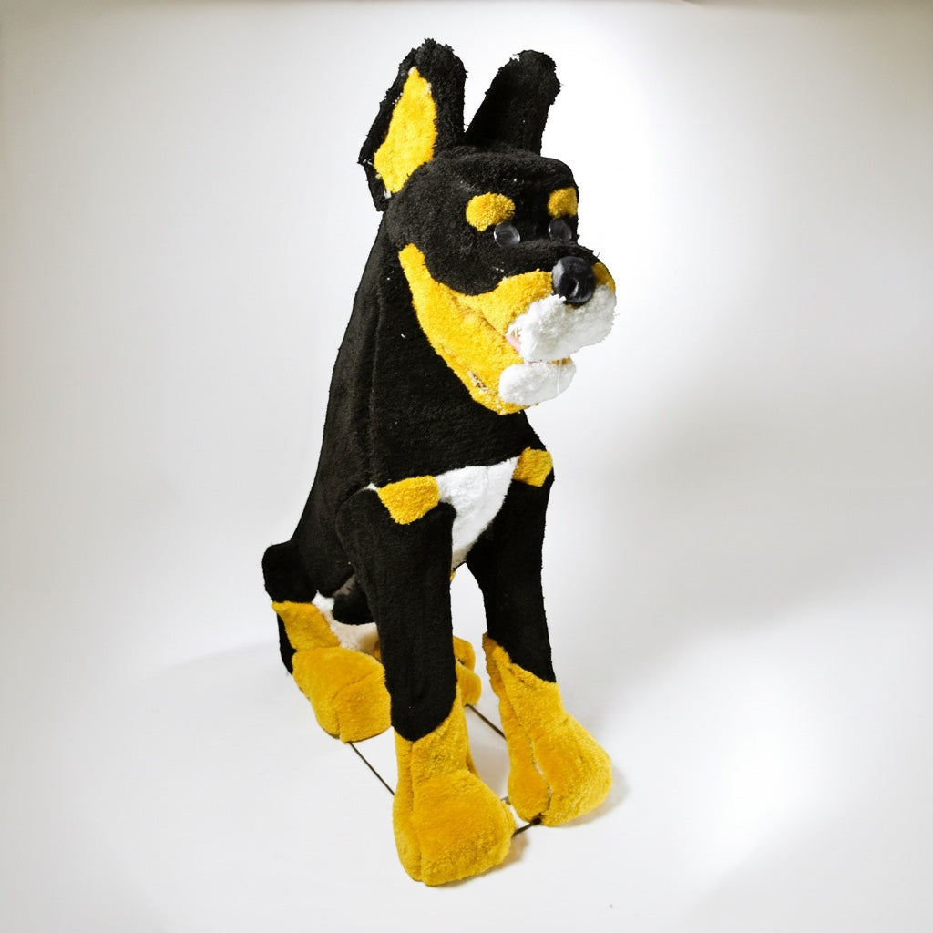 Outrageous Art 3D Braxton dog rug sculpture in black, tan, and white plush fabric with lifelike sitting posture.