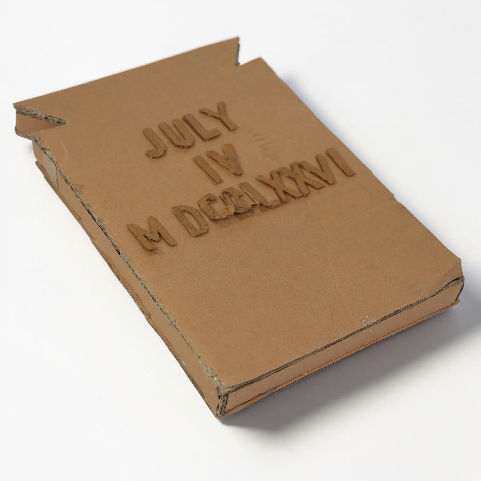 Outrageous Art handcrafted cardboard wall art featuring July 4 1776 in standard and Roman numerals with 3D texture.