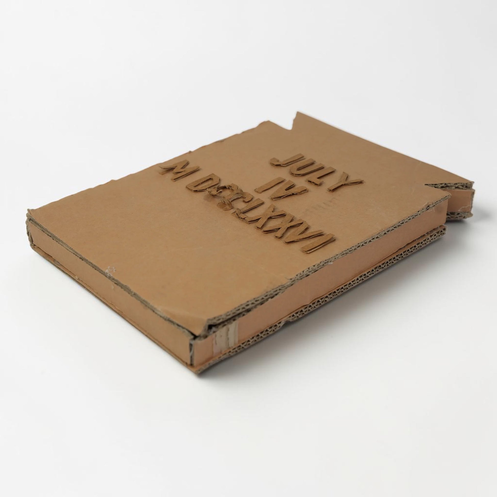 Outrageous Art handcrafted cardboard wall art featuring July 4 1776 in standard and Roman numerals with 3D texture.