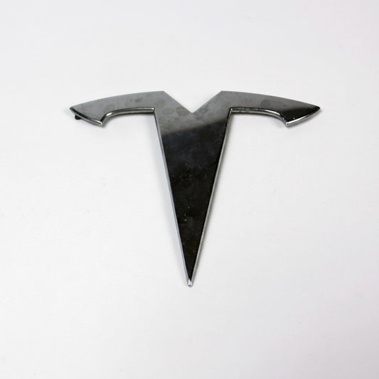 Outrageous Art metallic chrome automotive emblem for electric vehicles with a sleek polished finish