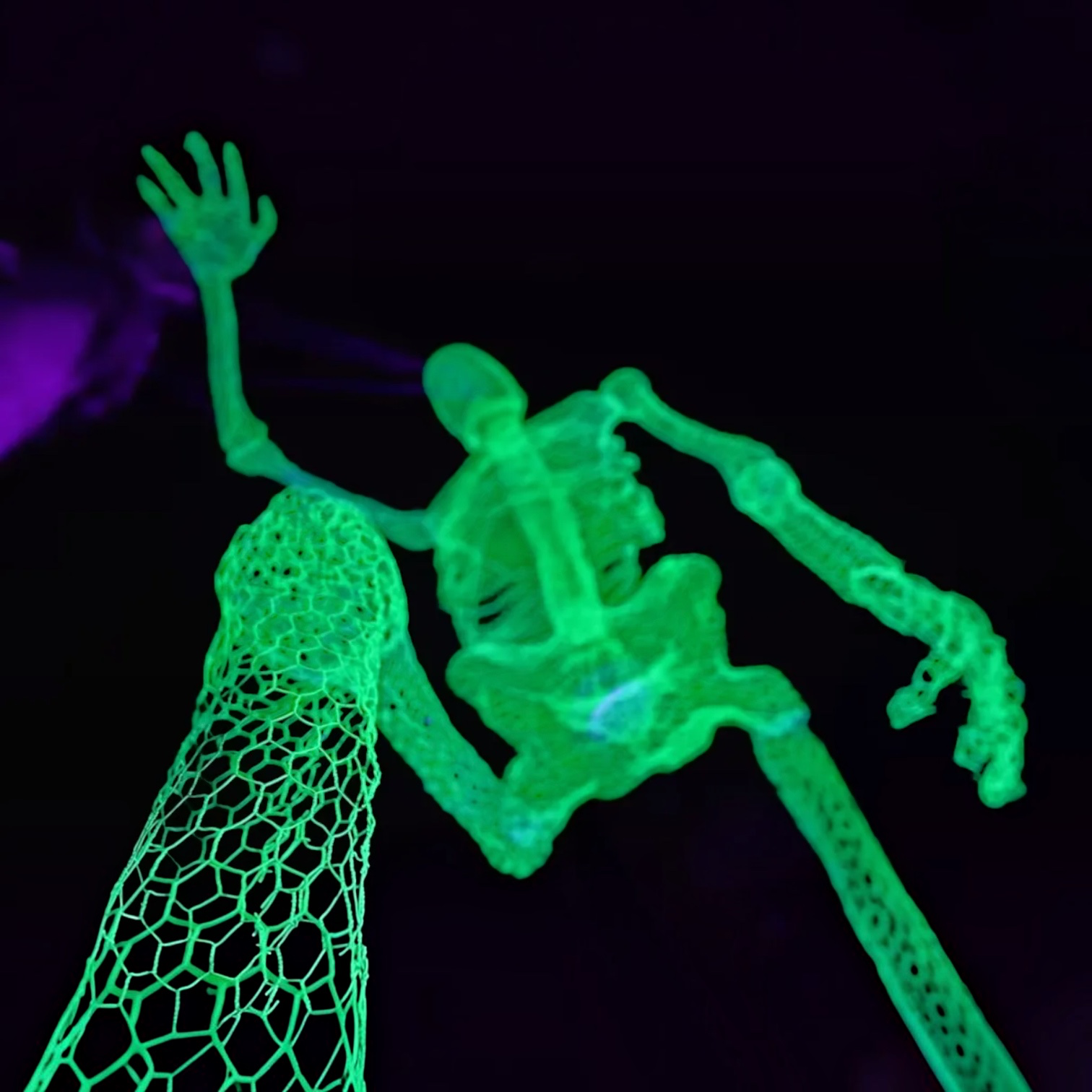Outrageous Art 12 foot glowing ghost skeleton with a unique honeycomb mesh texture for Halloween yard decor.