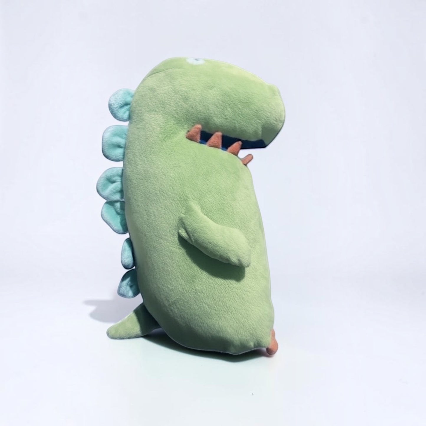 Outrageous Art lime-green plush dinosaur stuffed animal with light blue dorsal spikes and orange accents
