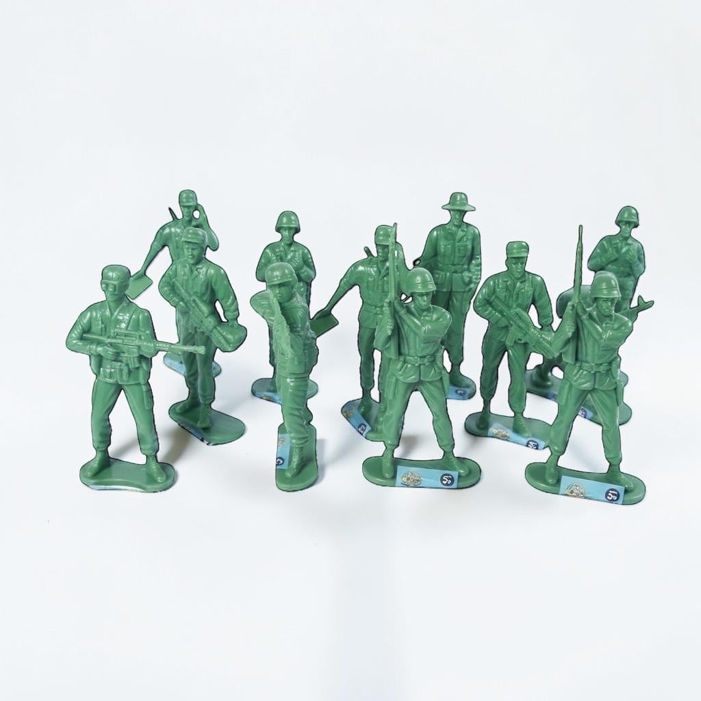 Outrageous Art set of green plastic miniature soldier action figures in various standing poses on a white background.