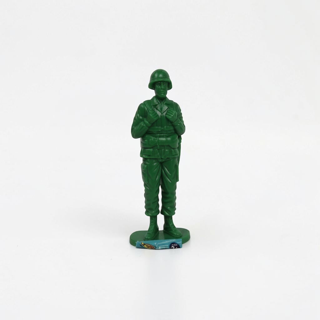 Outrageous Art classic green plastic miniature soldier action figure in a standing pose with helmet and uniform