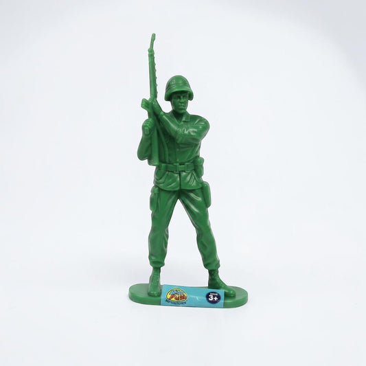 Outrageous Art green plastic toy soldier figurine in a standing military pose with a rifle on a white background