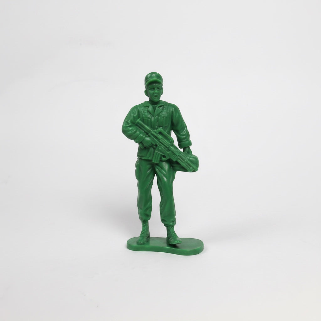 Outrageous Art classic green plastic toy soldier action figure standing on a base with a rifle