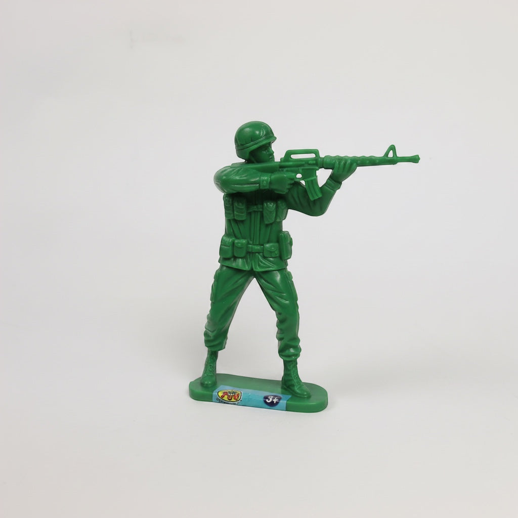 Outrageous Art classic green plastic toy soldier infantry figurine in a standing firing pose on a white background