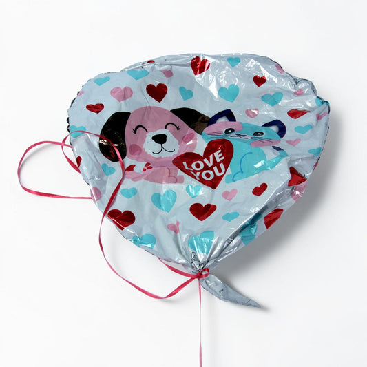 Outrageous Art heart-shaped foil balloon with puppy and kitten print, red and blue hearts, and LOVE YOU text with ribbon
