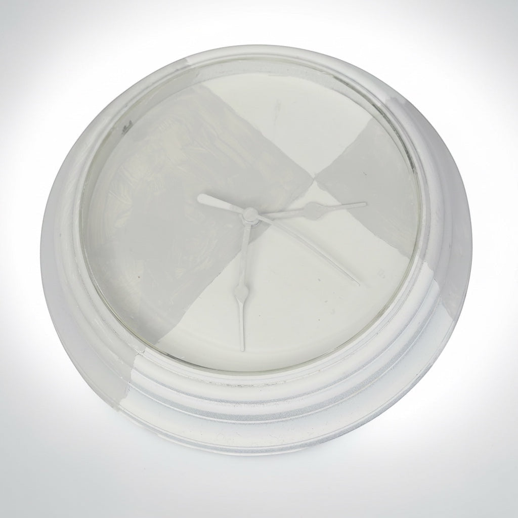 Outrageous Art Invisible Clock conceptual art piece featuring a white clock face and hands against a neutral background.