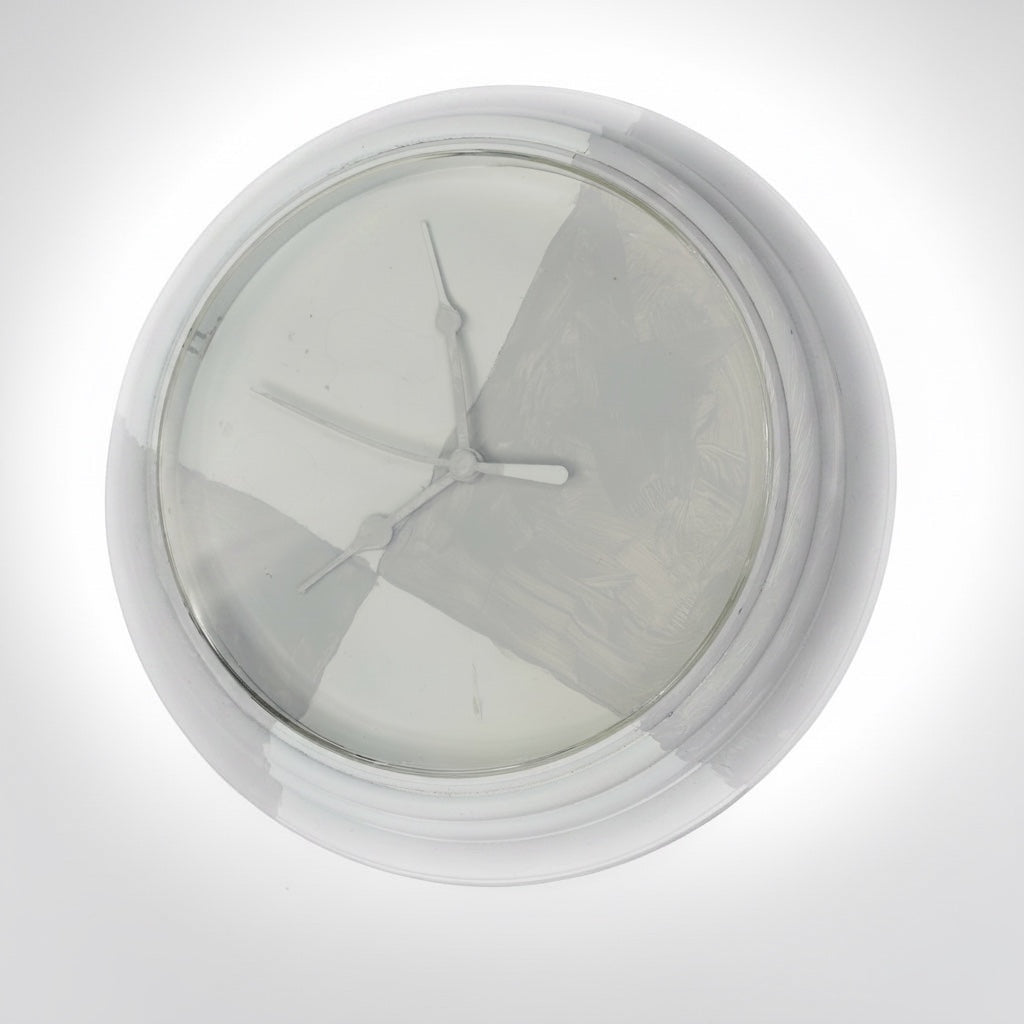 Outrageous Art Invisible Clock conceptual wall art piece with white painted glass and minimalist clock hands