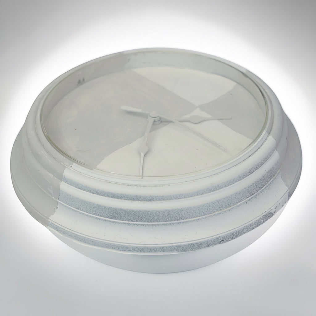 Outrageous Art Invisible Clock conceptual wall piece with white monochromatic finish and subtle textured details