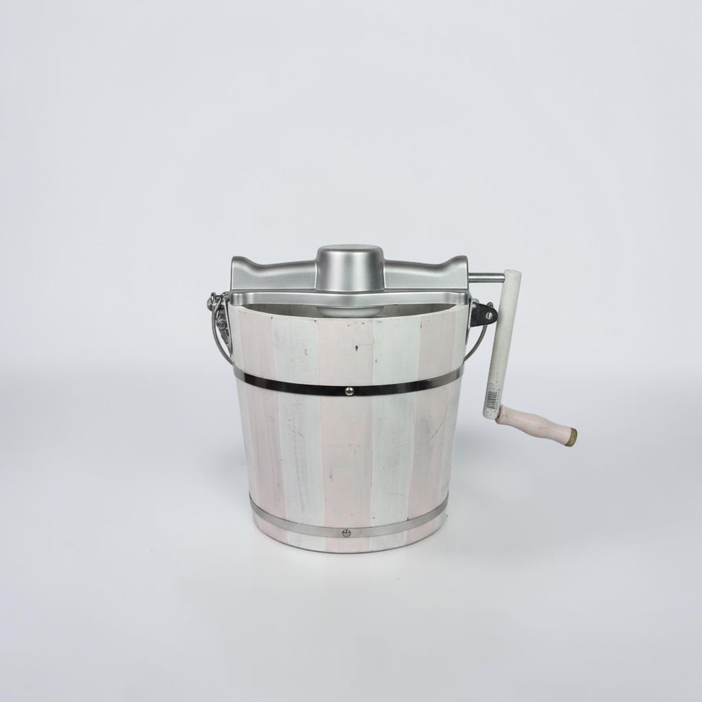 Outrageous Art traditional hand cranked ice cream maker with a distressed white and pink wooden bucket and silver top.