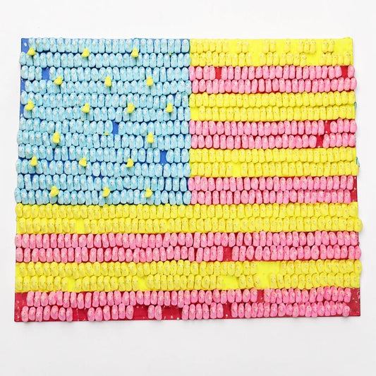 Outrageous Art patriotic American flag wall art made from colorful blue, yellow, and pink marshmallow candies.