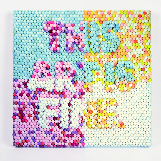 Outrageous Art Mentos Fine Art wall piece featuring the words THIS ART IS FINE made from thousands of colorful candies.