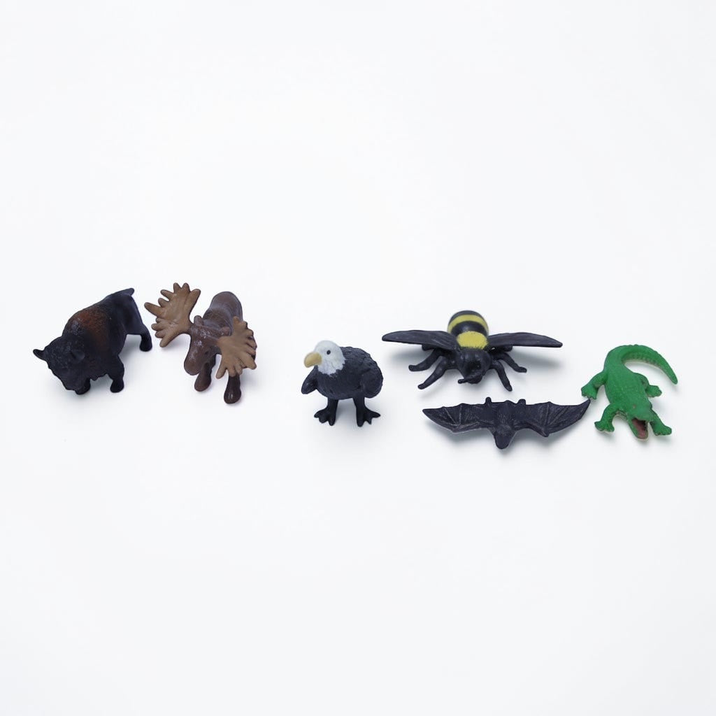 Outrageous Art miniature wild animal figurine set including a bison, moose, eagle, bee, bat, and green alligator.