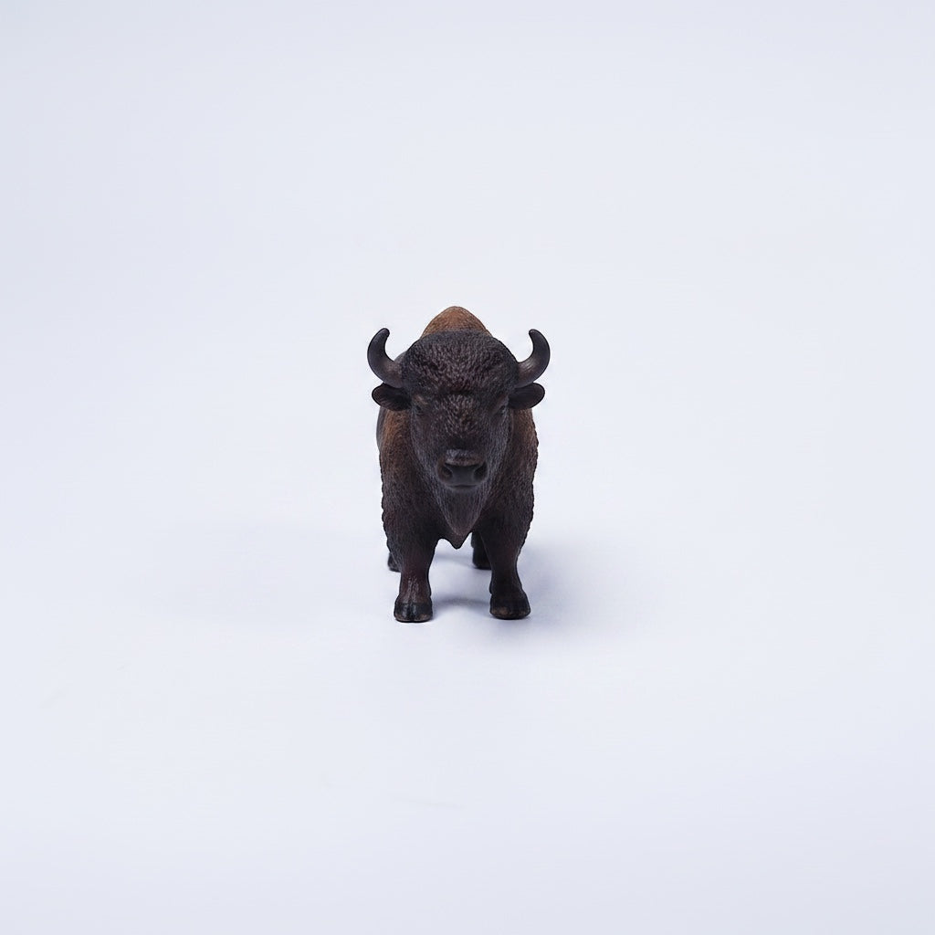 Outrageous Art miniature bison figurine with realistic brown fur texture and curved horns on a white background