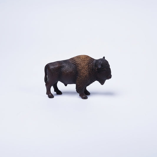 Outrageous Art miniature brown bison figurine with realistic fur texture and detailed features on a white background