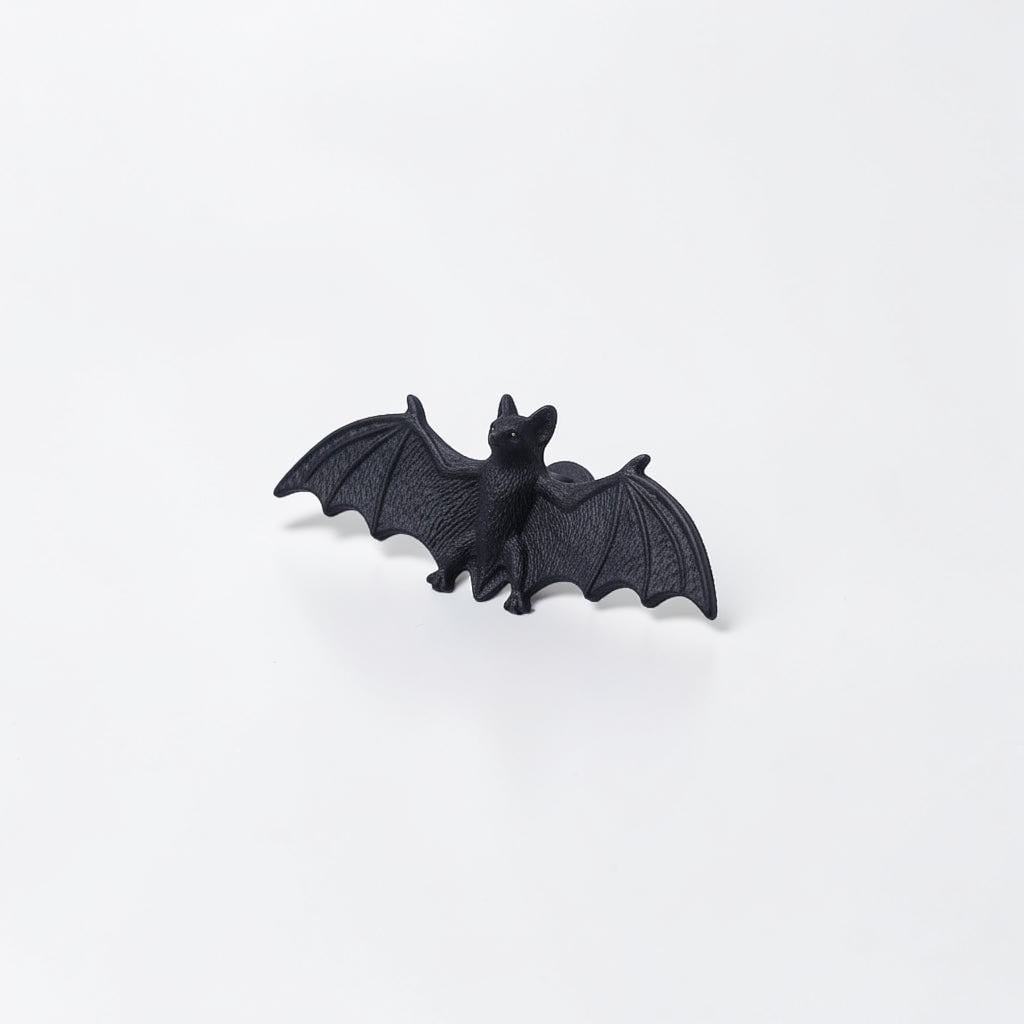 Outrageous Art miniature black bat figurine with detailed wings and realistic texture on a white background.