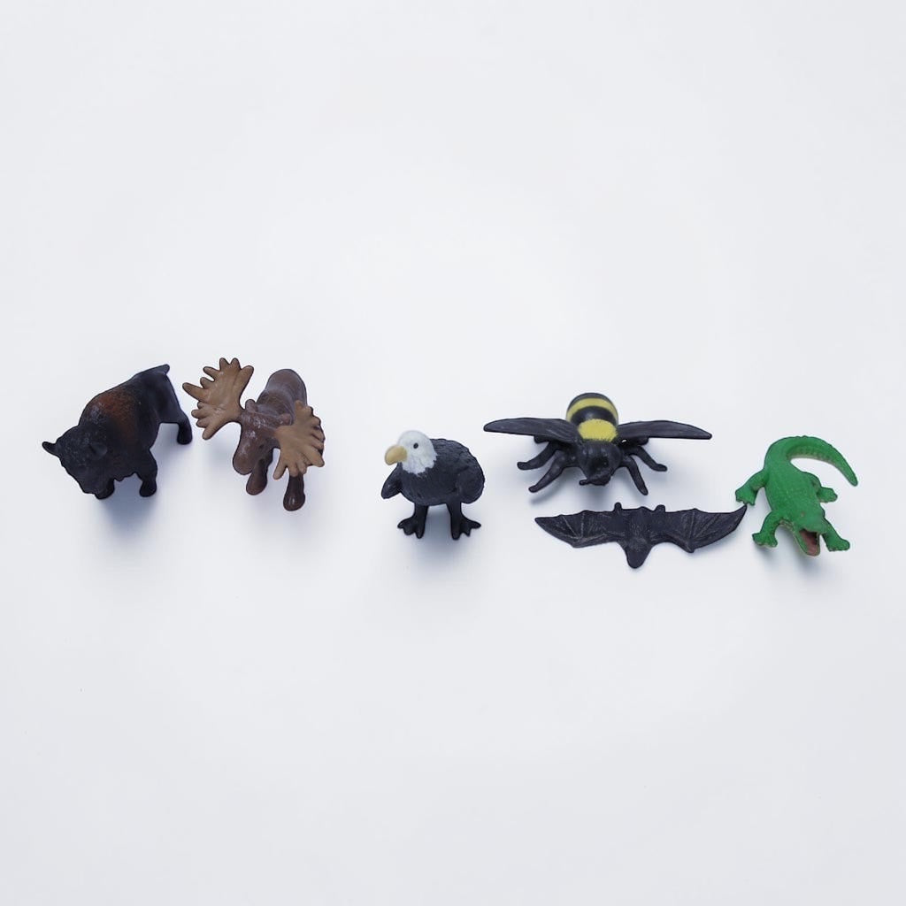 Outrageous Art miniature wildlife animal figurine set including a bison, moose, bald eagle, bee, bat, and alligator.