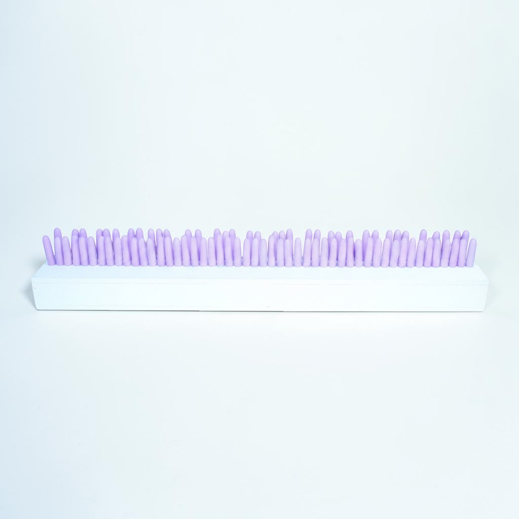 Outrageous Art abstract sculpture with pastel pink cylindrical pillars on a rectangular white base for modern decor.