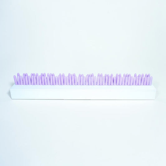 Outrageous Art abstract sculpture with pastel pink cylindrical pillars on a rectangular white base for modern decor.