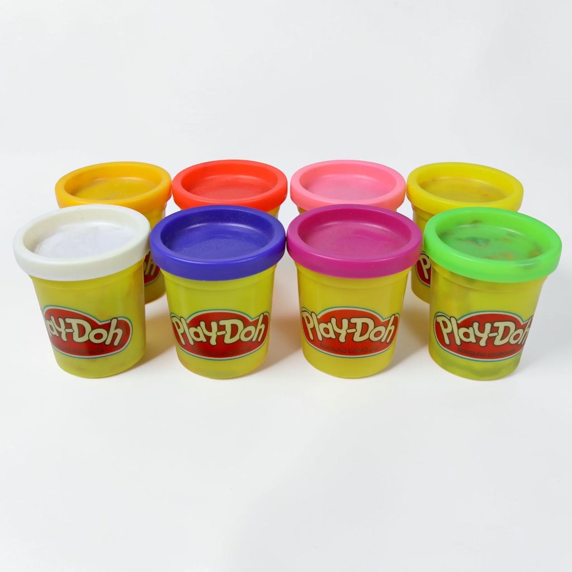 Outrageous Art Play-Doh modeling compound set featuring eight vibrant, colorful containers for creative play.