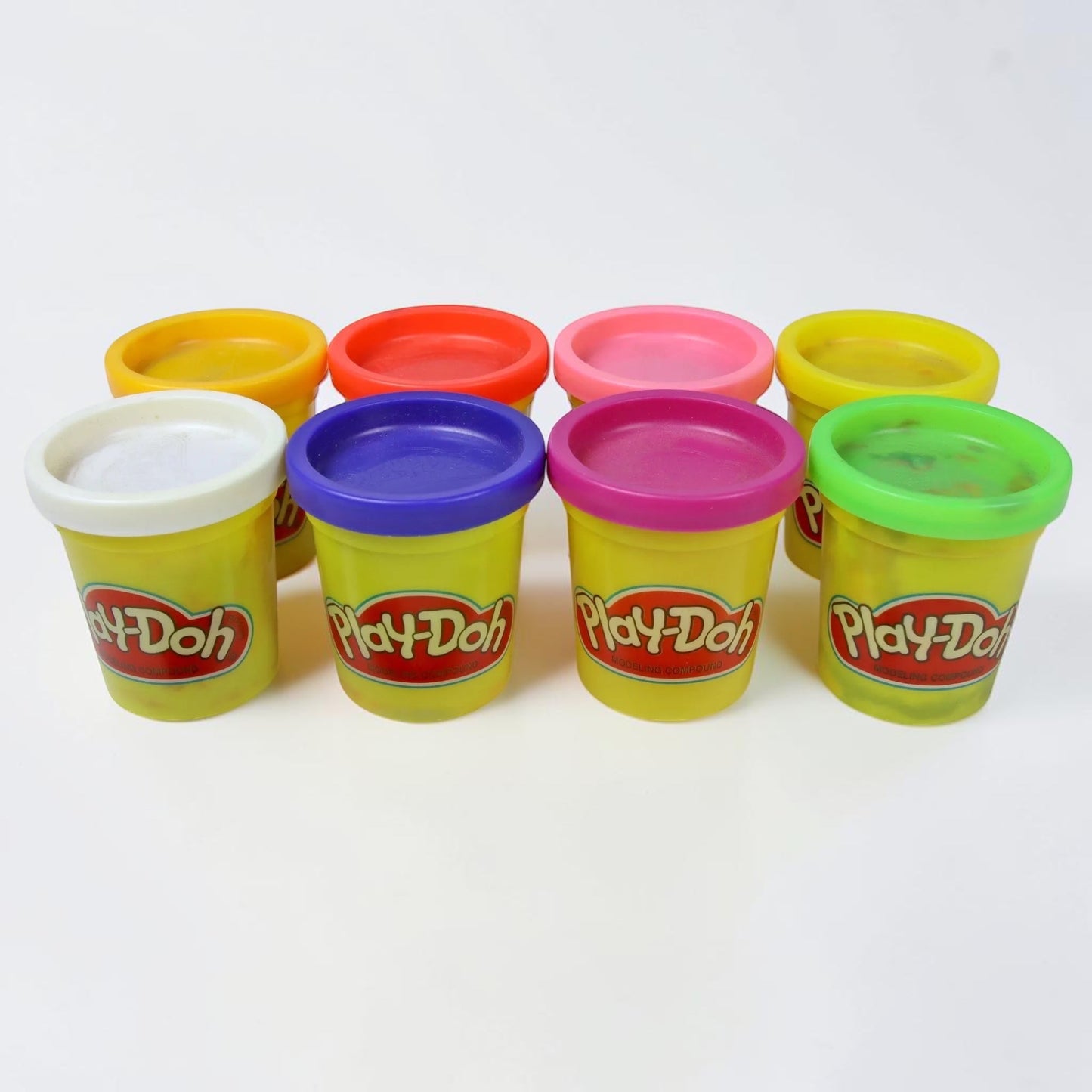 Outrageous Art Play-Doh modeling compound set featuring eight colorful containers with vibrant lids for creative play.