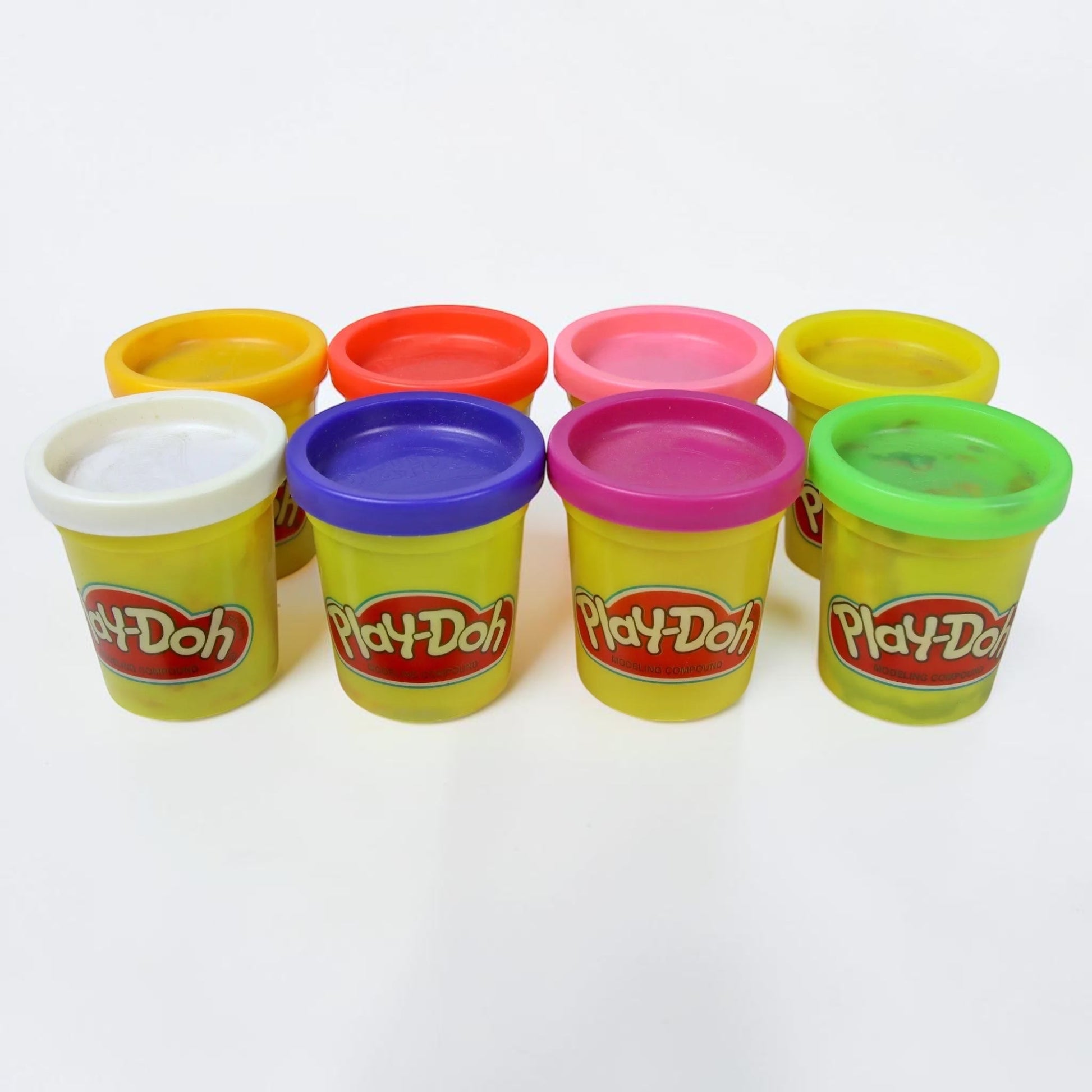 Outrageous Art Play-Doh modeling compound set featuring eight vibrant, colorful containers for creative kids' play.