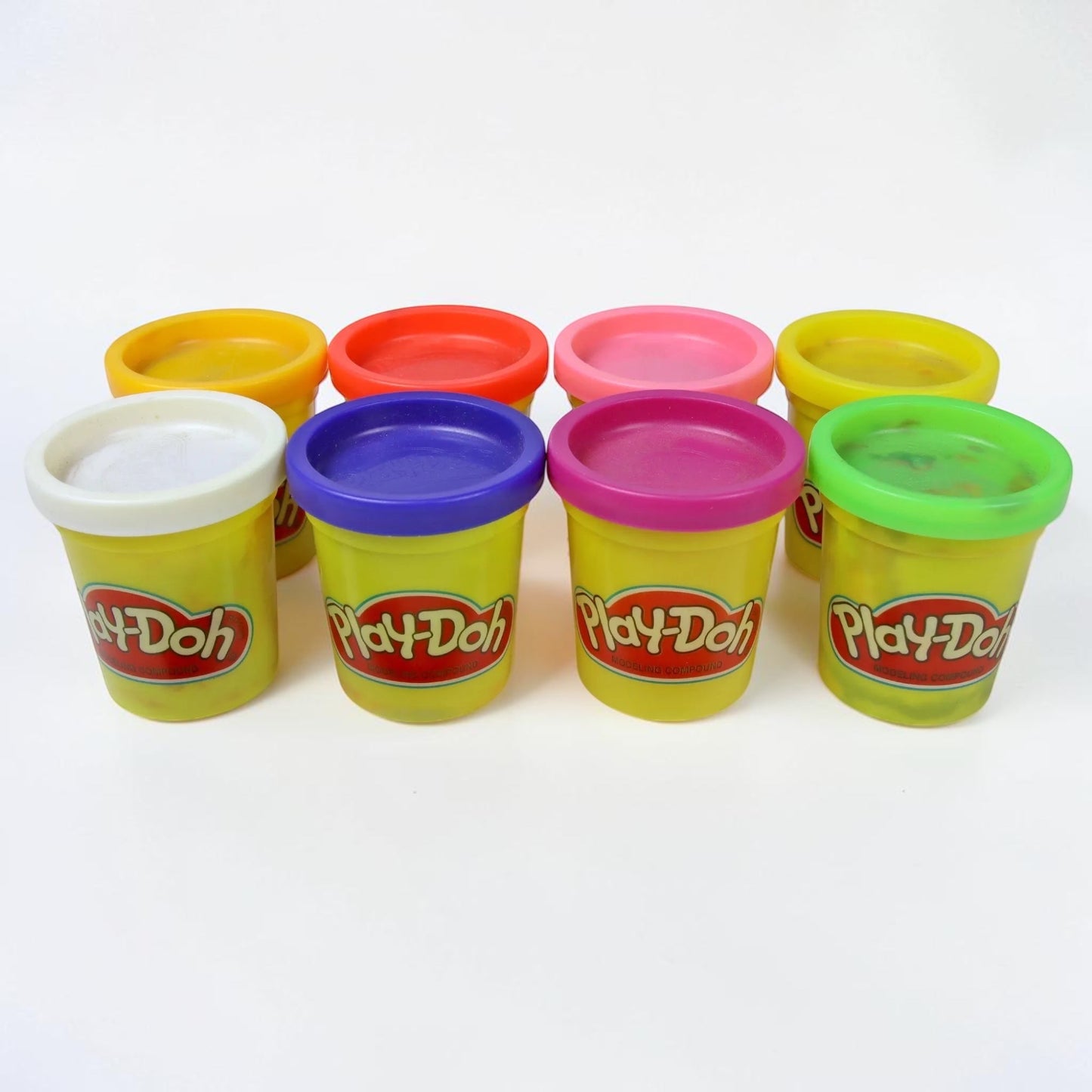 Outrageous Art Play-Doh modeling compound set featuring eight colorful, sealed plastic containers of soft dough.