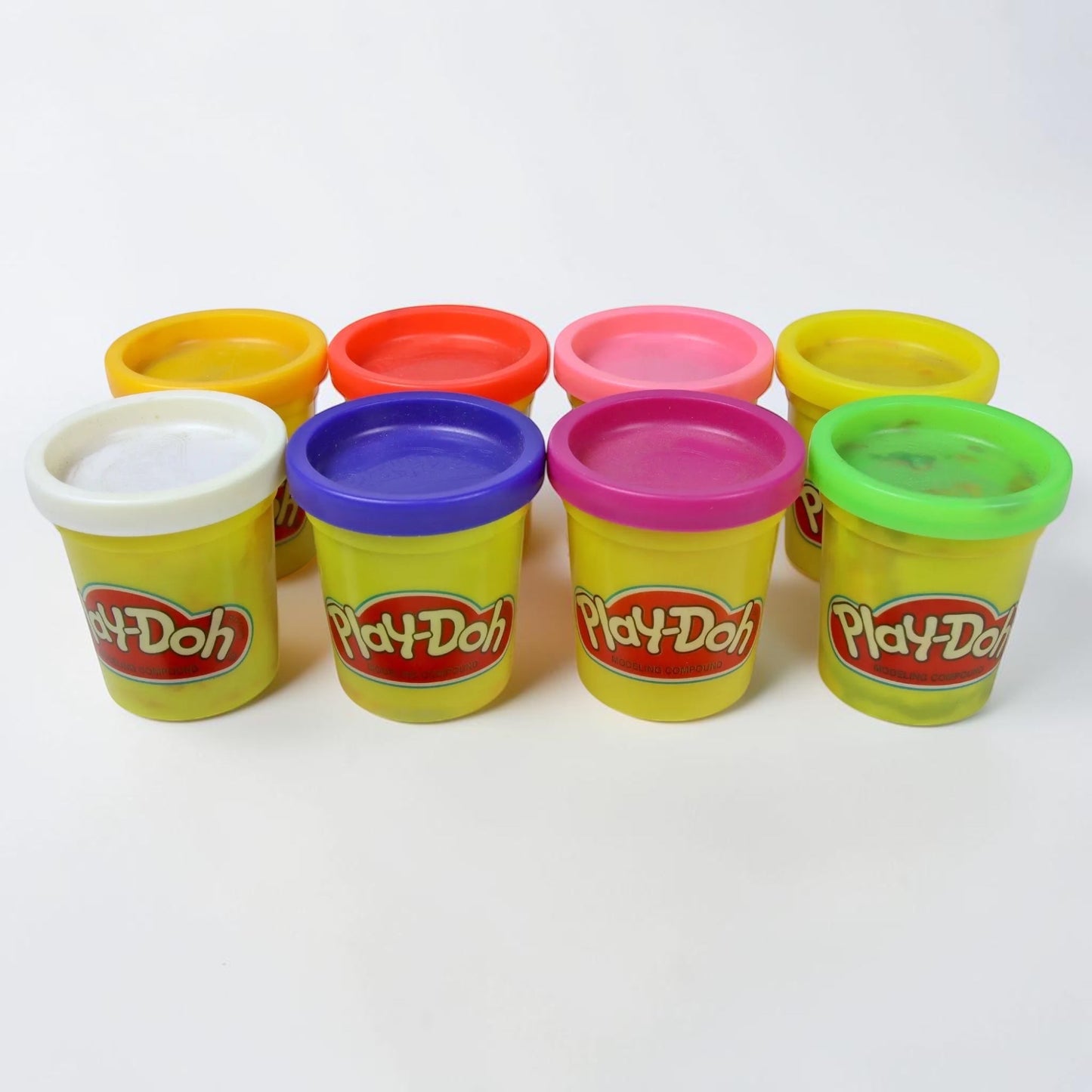 Outrageous Art Play-Doh modeling compound set featuring eight vibrant, colorful tubs for creative play.