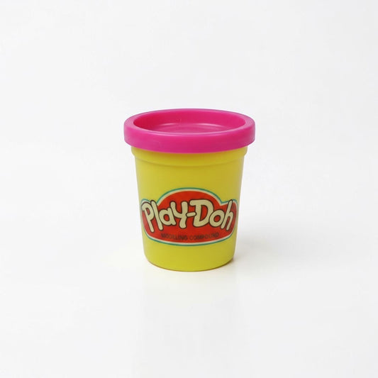Outrageous Art Play-Doh modeling compound in a yellow container with a bright pink lid against a white background