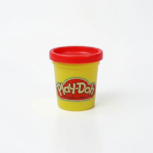 Outrageous Art Play-Doh modeling compound in a yellow container with a red lid on a white background