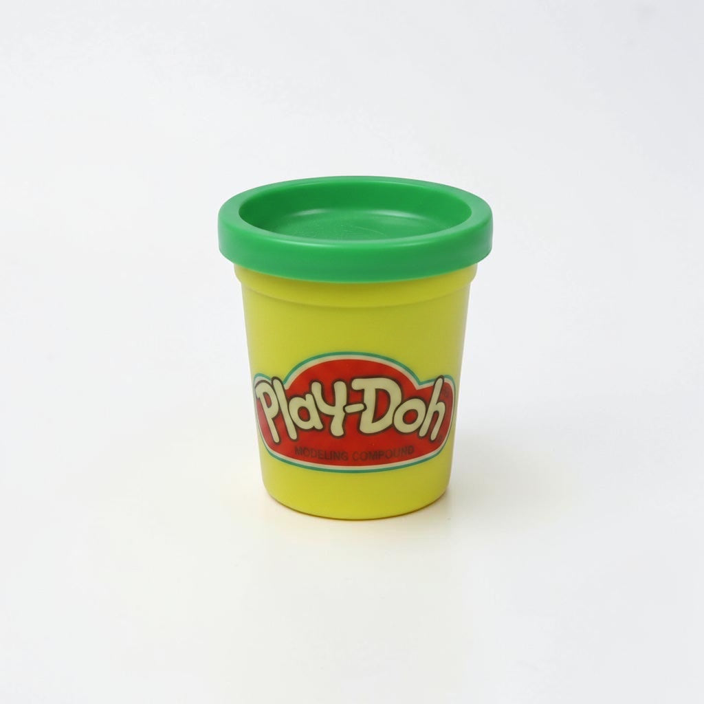 Outrageous Art Play-Doh modeling compound in a yellow container with a green lid against a plain white background.