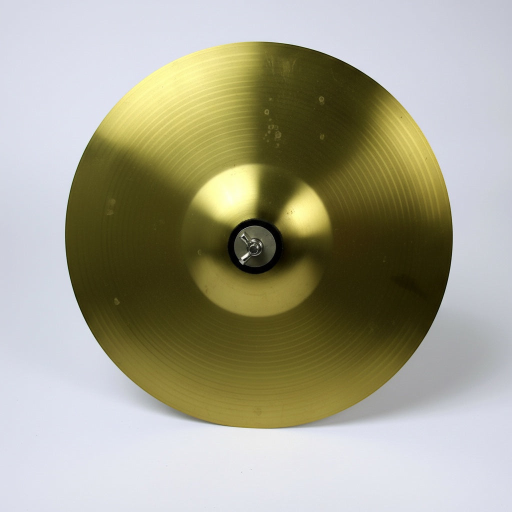 Outrageous Art professional brass percussion cymbal with a bright gold finish and circular lathe grooves