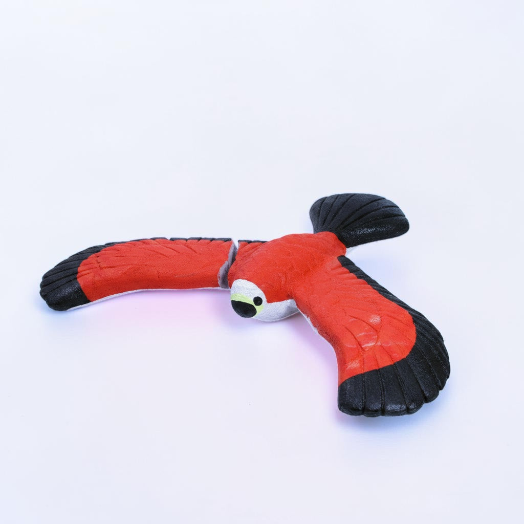 Outrageous Art handcrafted red and black balancing bird sculpture with detailed wings on a white background