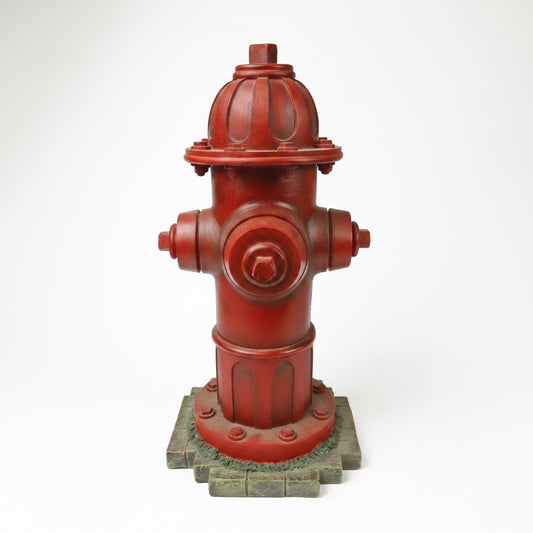 Outrageous Art red fire hydrant sculpture with a weathered industrial finish and realistic bolt details