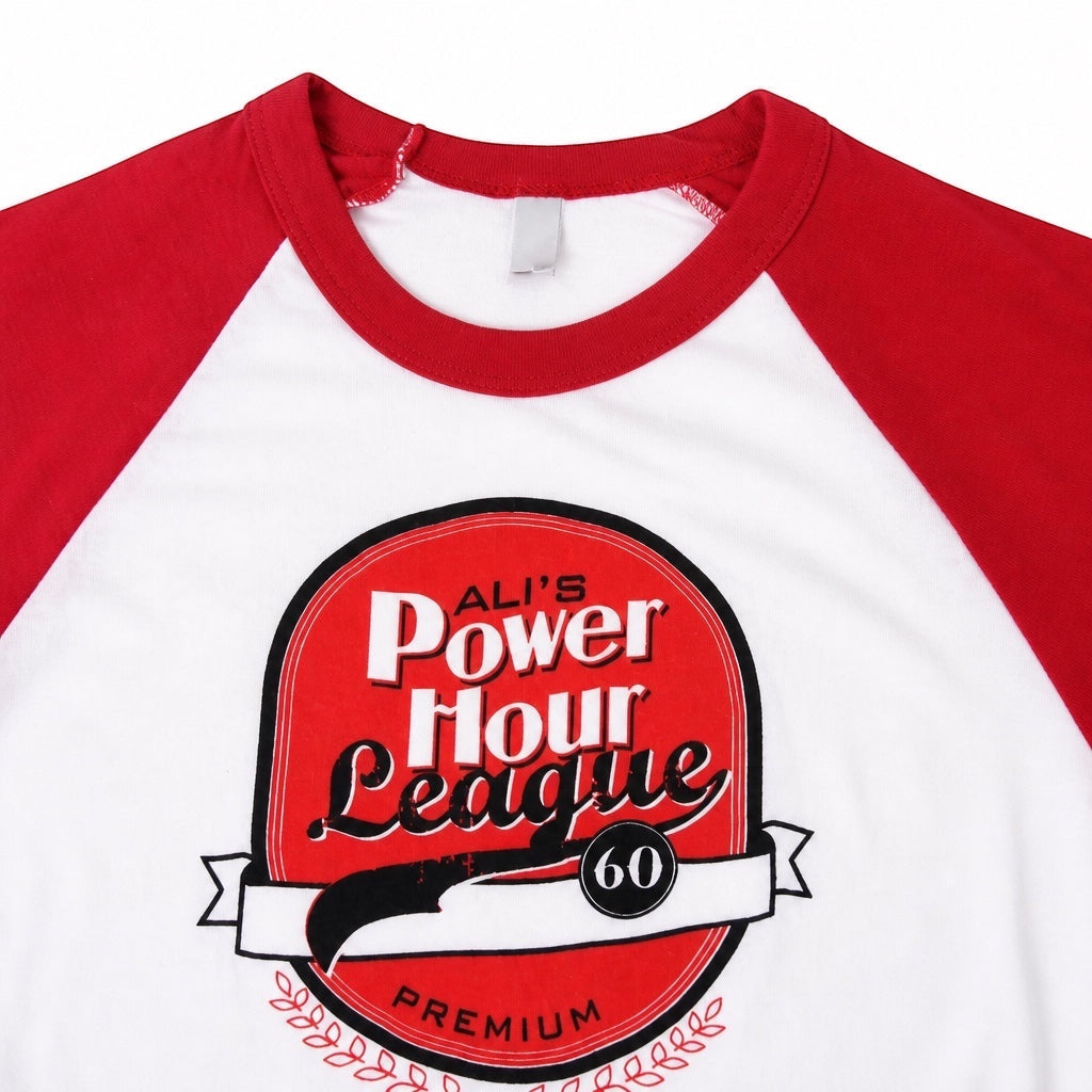 Outrageous Art Power Hour baseball tee with red raglan sleeves, white body, and Ali's Power Hour League graphic print.