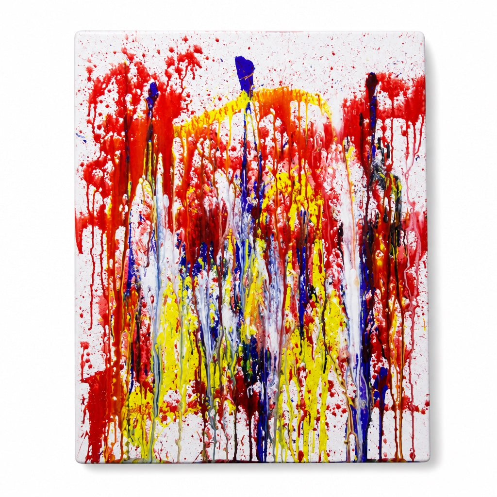 Outrageous Art squirt gun painting practice featuring vibrant red, yellow, and blue paint drips on a white canvas.