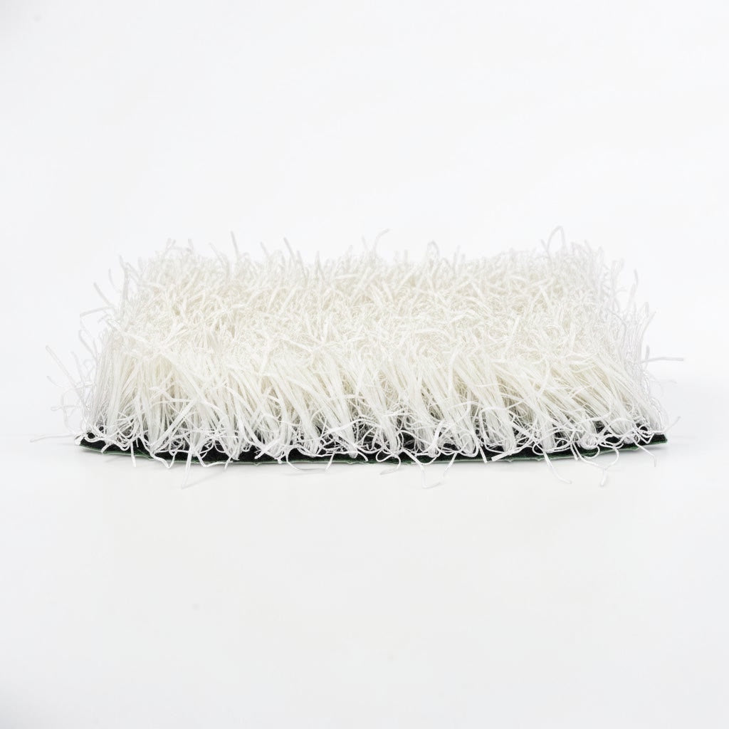 Outrageous Art white synthetic grass turf tile with dense, realistic fibers on a sturdy backing for event displays.