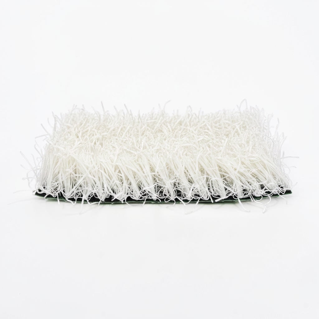 Outrageous Art white synthetic grass turf tile with dense, realistic fibers on a sturdy backing for event displays.