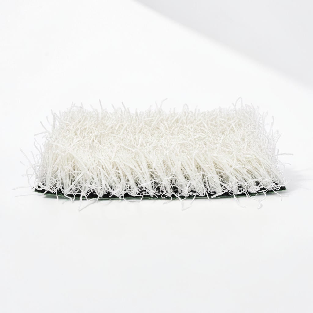 Outrageous Art white synthetic grass turf tile with dense, realistic fibers on a sturdy backing for event displays.