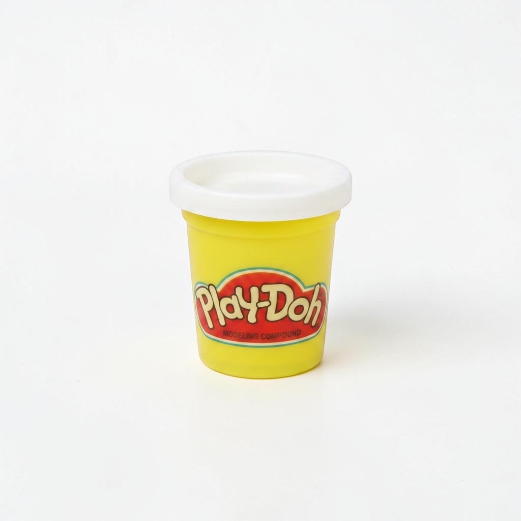 Outrageous Art yellow Play-Doh modeling compound container with a white lid on a white background