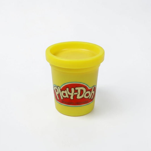 Outrageous Art yellow Play-Doh modeling compound tub with iconic red logo on a clean white background.